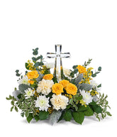 A stunning arrangement featuring yellow roses (deluxe & premium only), yellow spray roses, light yellow carnations, white mums, yellow solidago, and floral greens, elegantly accented with a crystal cross. This vibrant mix offers a bright and uplifting dis