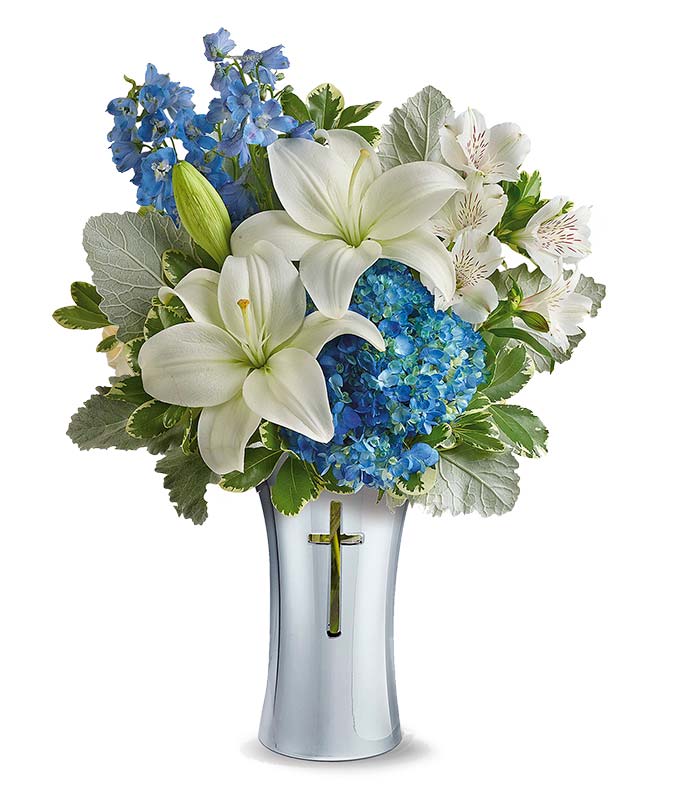 Cross vase with white roses and blue hydrangea