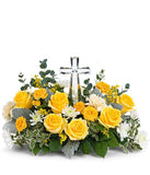 A stunning arrangement featuring yellow roses (deluxe & premium only), yellow spray roses, light yellow carnations, white mums, yellow solidago, and floral greens, elegantly accented with a crystal cross. This vibrant mix offers a bright and uplifting dis