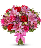 Red roses, pink lilies and pink alstroemeria and glass vase