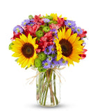 Floral arrangement featuring sunflowers, red alstroemeria, pink roses (in deluxe and premium versions), purple monte casino, and green button poms in a mason jar vase, with a personalized card message.
