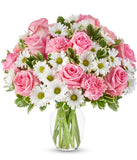 Pink roses, pink carnations and white daisies in a pink vase